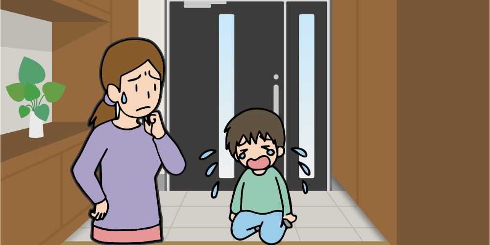 玄関先で泣く小学生